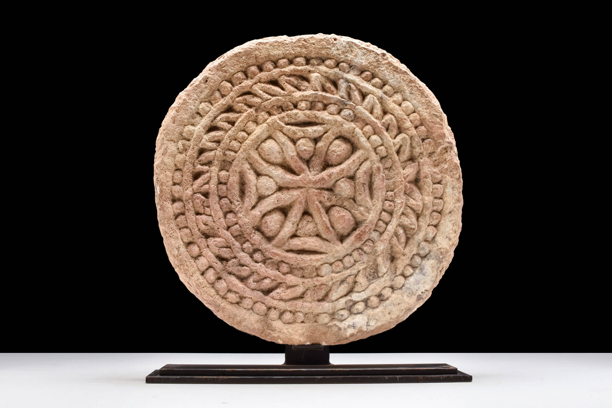 BYZANTINE LIMESTONE ARCHITECTURAL ROUNDEL WITH CROSS