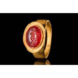 HELLENISTIC GOLD RING WITH CARNELIAN INTAGLIO DEPICTING MARSYAS