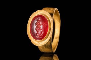 HELLENISTIC GOLD RING WITH CARNELIAN INTAGLIO DEPICTING MARSYAS