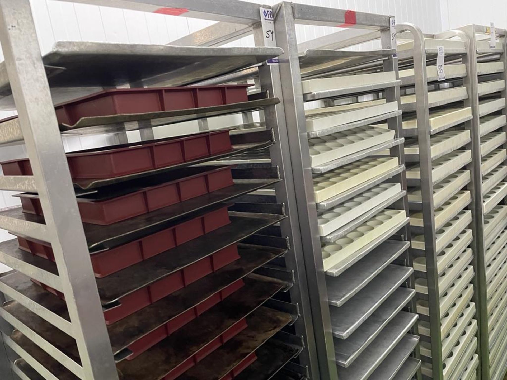 5 Mobile Tray Racks & Contents Comprising Various Moulds (Location: NW London. Please Refer to