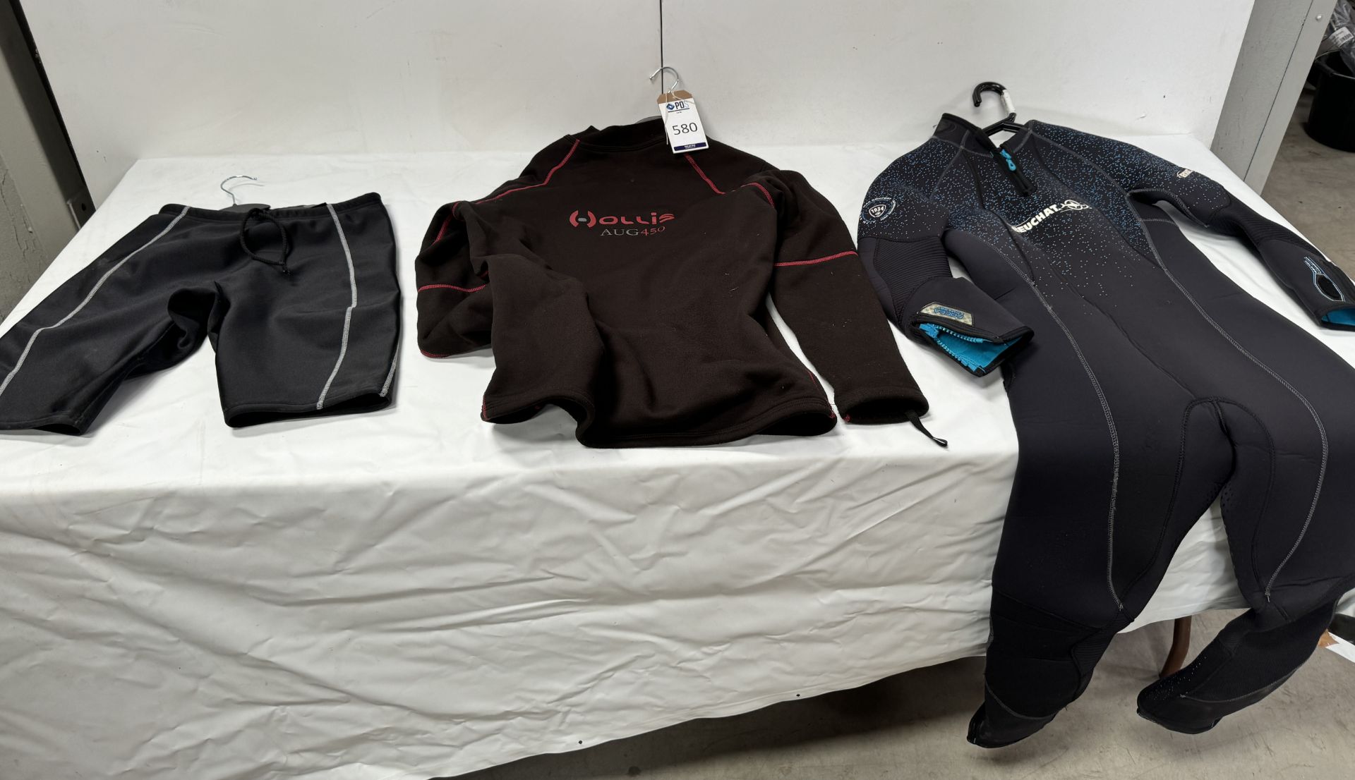 Four Various Wetsuits with Fourth Element Shorts & Hollis Thermal Top (Location: Brentwood. Please