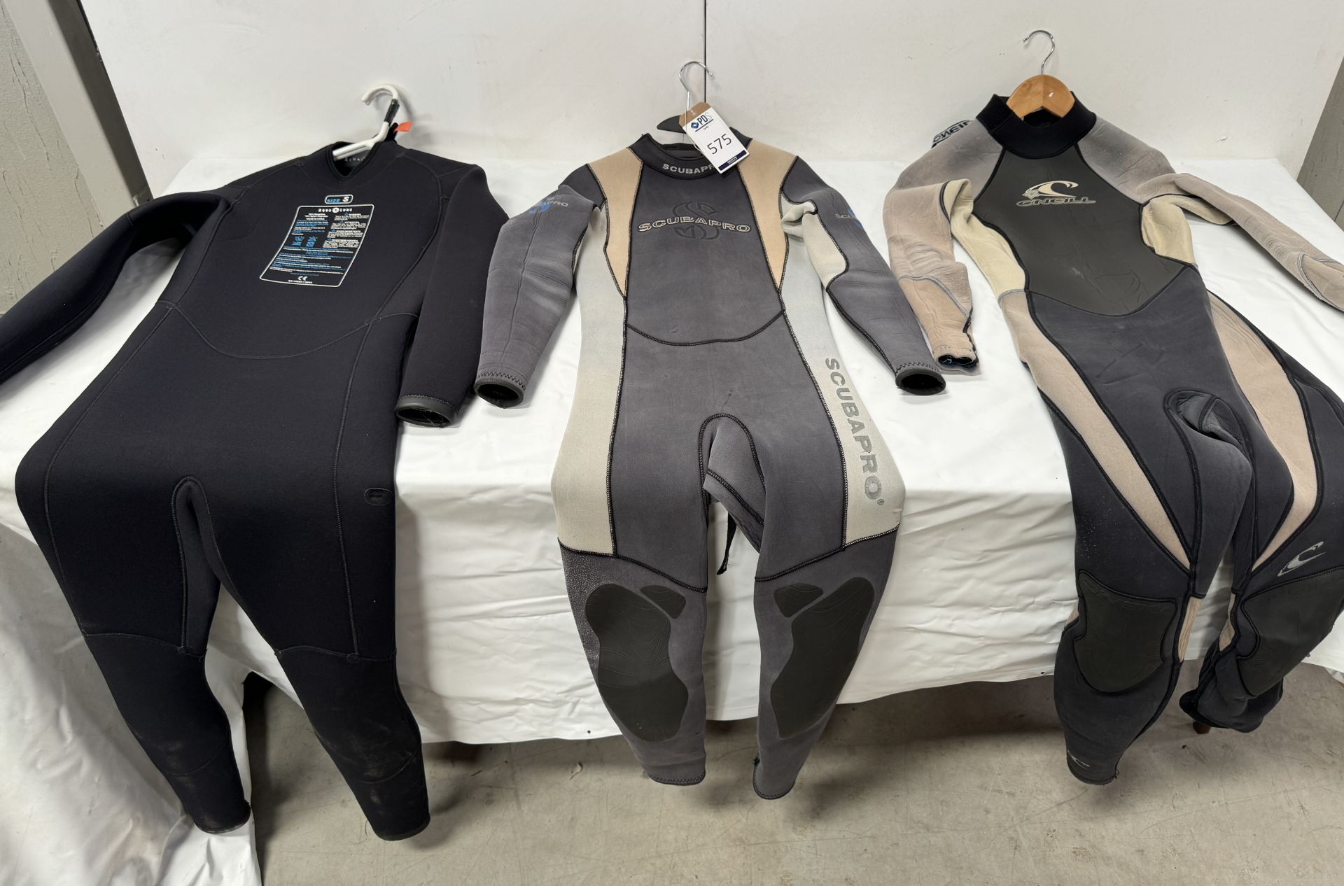 Three Various Wetsuits (Location: Brentwood. Please Refer to General Notes)