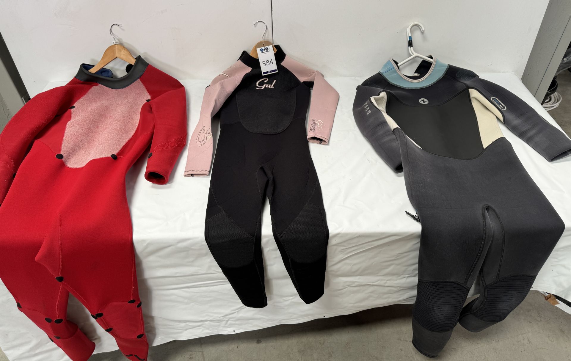 Six Various Wetsuits & Pair of Polar Bears Dungarees (Location: Brentwood. Please Refer to General