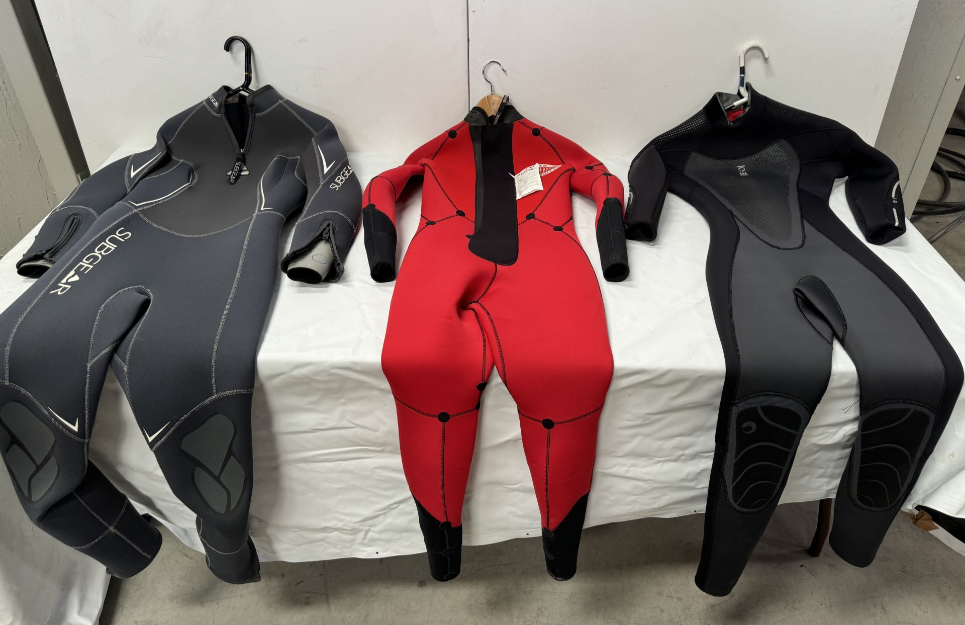 Six Various Wetsuits (Location: Brentwood. Please Refer to General Notes)