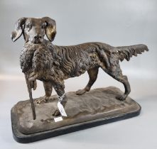 Bronze gun dog with pheasant in mouth on a naturalistic and marble base. Appearing unsigned. 48cm