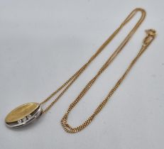 9ct gold fine chain with oval pendant inset with three white stones. 2.9g approx. (B.P. 21% + VAT)