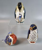 Three Royal Crown Derby English bone china paperweights to include: 'Rockhopper Penguin', another