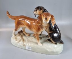 Large Royal Dux Czechoslovakia porcelain group of two hounds, on an oval naturalistic base.