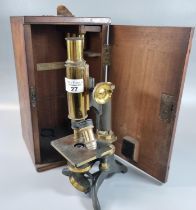 Brass monocular microscope marked ' Baker, of London' in fitted wooden case with additional