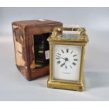 Brass carriage clock with full depth enamel dial marked 'J S Rambridge of Salisbury'. Leather