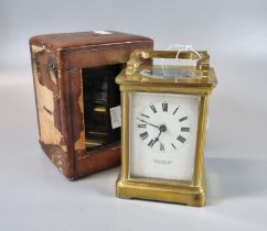 Brass carriage clock with full depth enamel dial marked 'J S Rambridge of Salisbury'. Leather