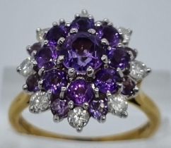 18ct gold diamond and probably tanzanite multi cluster ring comprising a total of eight diamonds. 6g