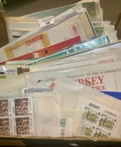 Jersey collection of First Day Covers, presentation packs and stamps in mint blocks of four sets. (