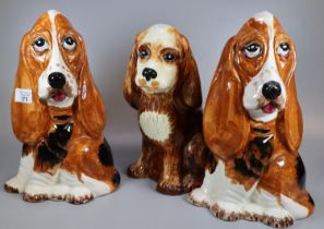 Three Price Kensington pottery studies of dogs; one Spaniel and two 'Fred' Basset hounds. Printed