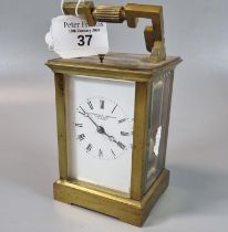Brass carriage clock, the full depth Roman enamel face marked 'Parkinson & Frodsham, London', with