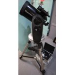 Celestron CPC Series telescope on stand with various accessories including: cased lenses,