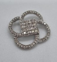 White gold and modernist multi-cluster diamond pendant, the square centre with sixteen diamonds. 2.
