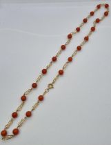 18ct gold and coral necklace. 12.5g approx. (B.P. 21% + VAT)