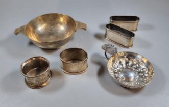 Collection of silver items to include: four napkin rings together with a silver Quaich, Sheffield