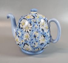 Shelley china teapot on a blue ground overall decorated with daisies. (B.P. 21% + VAT)