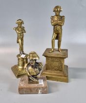 Two brass figures of Napoleon Bonaparte on plinths, together with a bust of Napoleon marked '