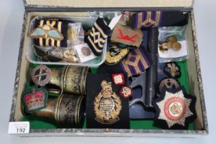 Box of assorted Army insignia and badges to include: cap badges, Naval epaulettes, Welsh Infantry