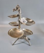 White metal hors d'oeuvres stand in the form of a Giraffe with various dishes around its neck.