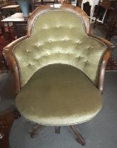 Unusual mahogany framed upholstered button back club style chair with scroll decorated cast iron