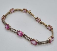 9ct gold pink nine stone bracelet. 7.7g approx. (B.P. 21% + VAT)