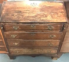 18th century mahogany fall front bureau above an arrangement of four drawers on bracket feet. (B.