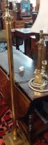 Collection of brass lighting to include: pair of table lamps and a standard lamp, all decorated with