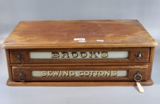 Vintage Brook's Glacethread advertising sewing cabinet marked 'Sewing cottons', the two drawers with