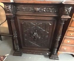 Late Victorian oak Flemish design carved cabinet, the moulded and indented cornice above a single