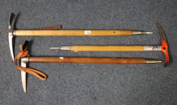 Group of three vintage ice axes with leather thongs with ash handles, one bearing signature 'Ed