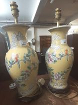 Pair of Chinese yellow ground baluster vases, now converted to lamp bases on hardwood stands
