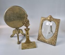 Brass trivet in the form of a snap top pedestal table, a repoussé brass picture frame and brass