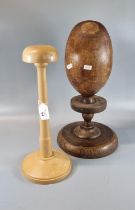 Vintage milliners turned wooden hat block, together with another modern beech hat block or stand. (