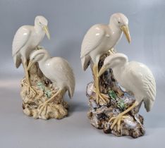 A pair of continental (probably German) majolica spill vases, decorated with herons on