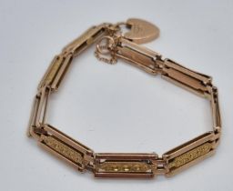 9ct rose gold three bar gate bracelet with heart padlock. 11.5g approx. (B.P. 21% + VAT)