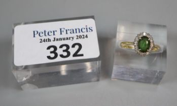 18ct gold on platinum diamond and green stone ring. 2.9g approx. Size K1/2. (B.P. 21% + VAT)