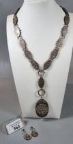 Unusual Victorian white metal aesthetic design chain and locket with matching earrings. Total weight
