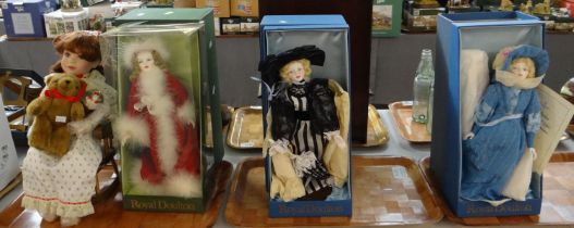 Four Royal Doulton dolls to include: Nisbet dolls; 'Henley Regatta', 'Ascot' and a Christmas doll in