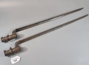 Pair of 19th century, probably British, socket bayonets with triangular fluted blades. 53cm long
