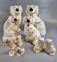 Collection of pottery dog studies to include: two pairs of Beswick seated fireside Spaniels in
