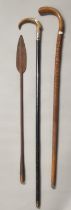Two walking sticks; one heavily carved with text; 'Thomas Joseph Esq, 1876, Colliery Proprieter