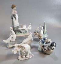 Three Lladro Spanish porcelain figurines to include: girl washing dog (with original box), an