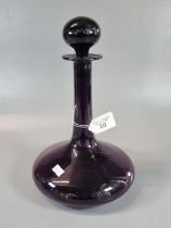 Amethyst coloured glass ships type decanter and stopper. (B.P. 21% + VAT)