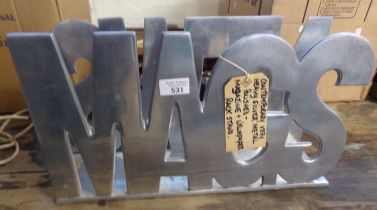 Metal silver finish magazine rack/stand marked 'Mags' and 'New' to the reverse. (B.P. 21% + VAT)