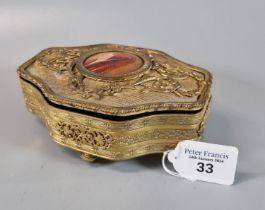 Early 20th century ornate ormolu trinket box with relive folate and floral designs, having central