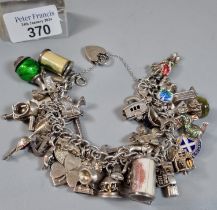 Silver chunky charm bracelet, various charms including: ingot, heart shaped padlock, Ich Dien